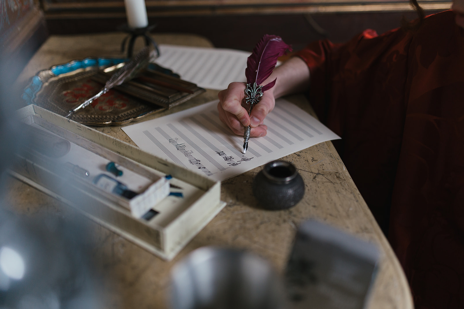 Composing with quill on sheet music
