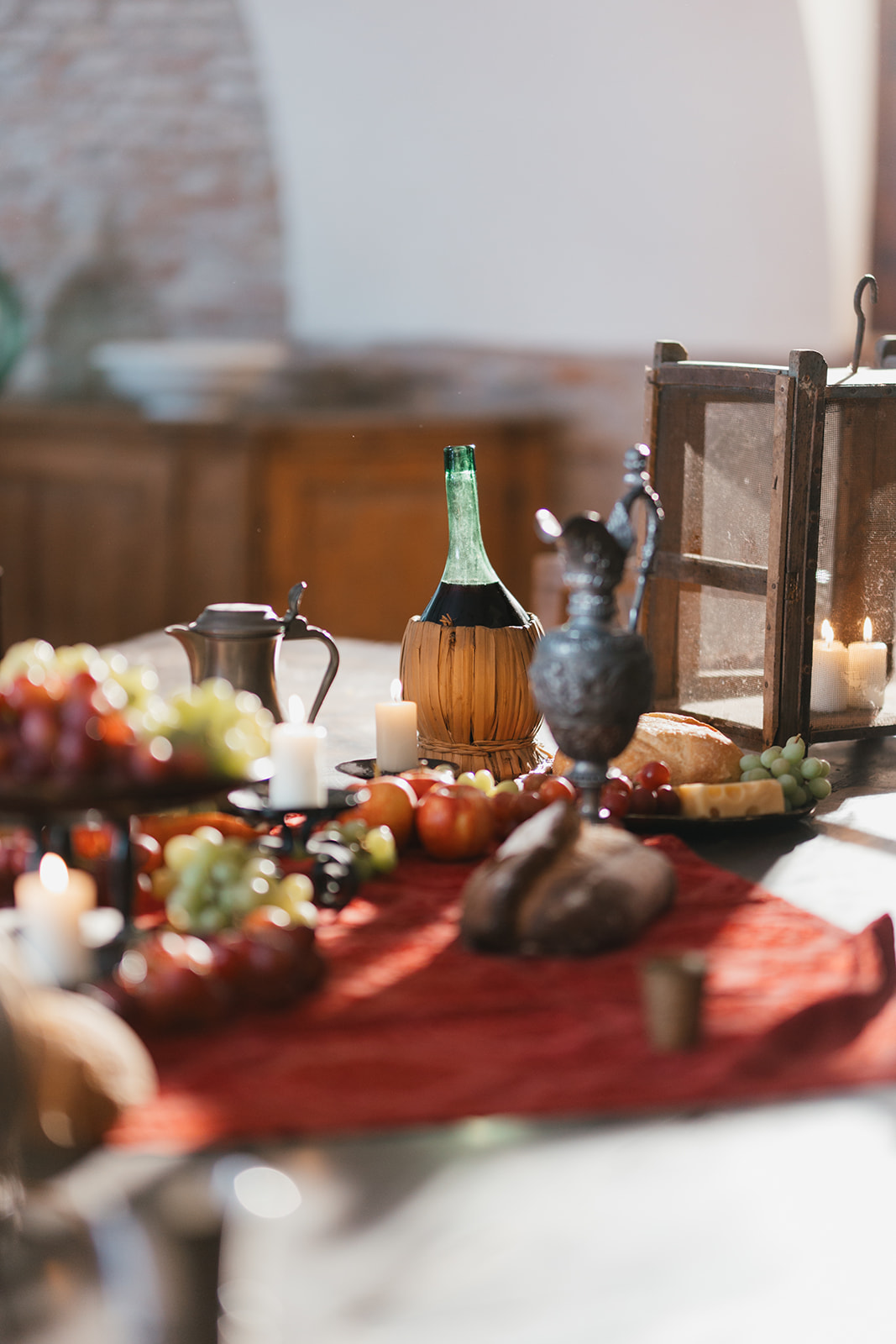 Harvest table with wine, fruit and candles