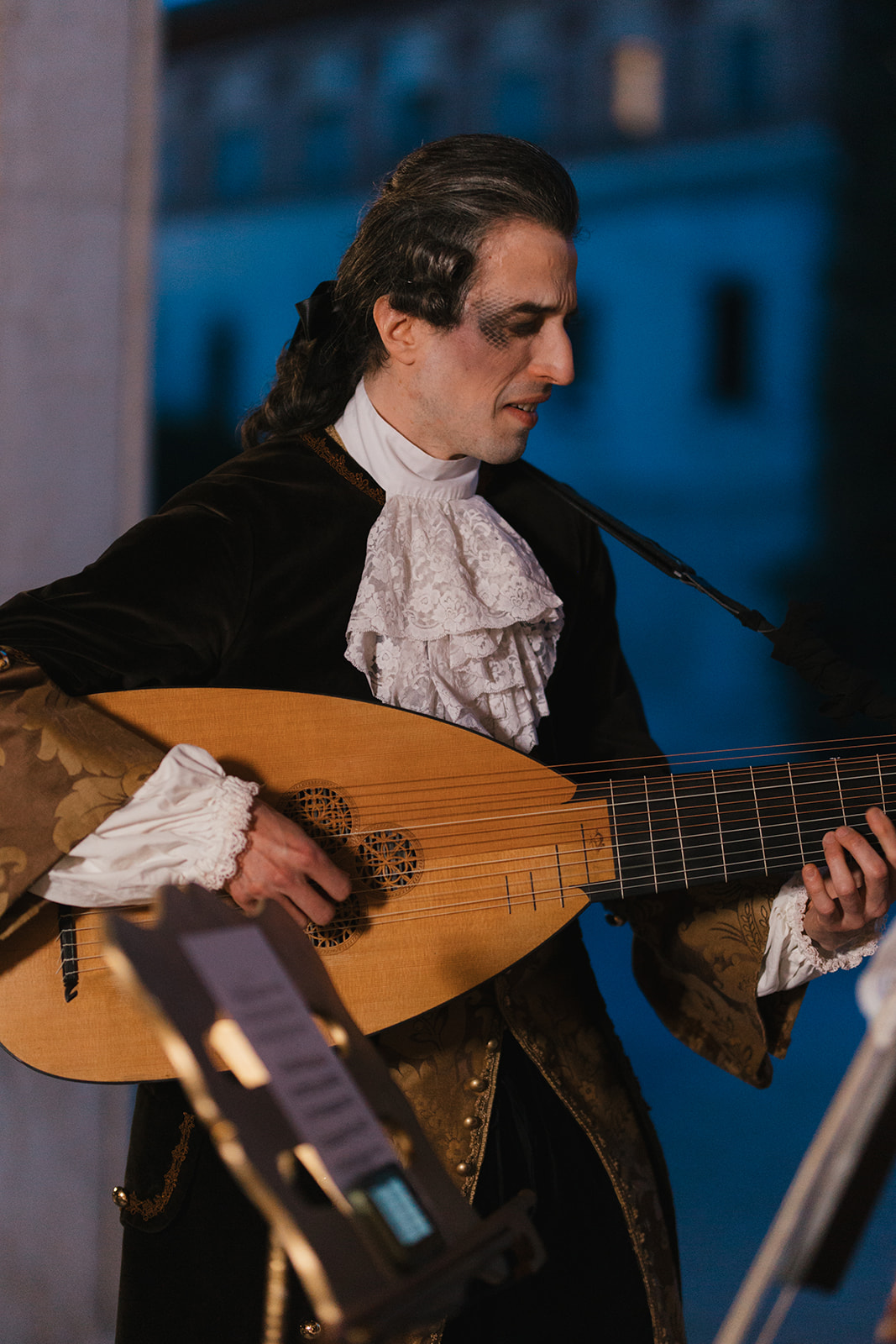 Lute player in baroque costume
